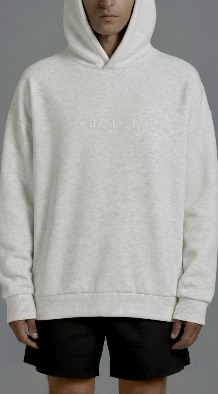 Gray hoodie with a floral design on the back against a gray background